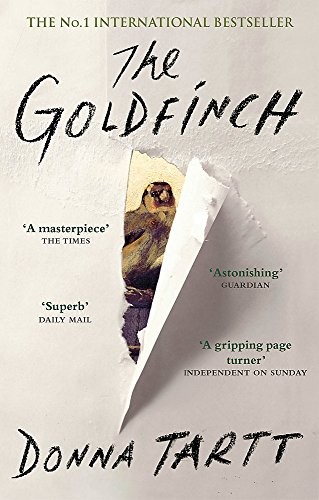 Cover of The Goldfinch by Donna Tartt — a torn paper opening revealing the small painting of a chained goldfinch.